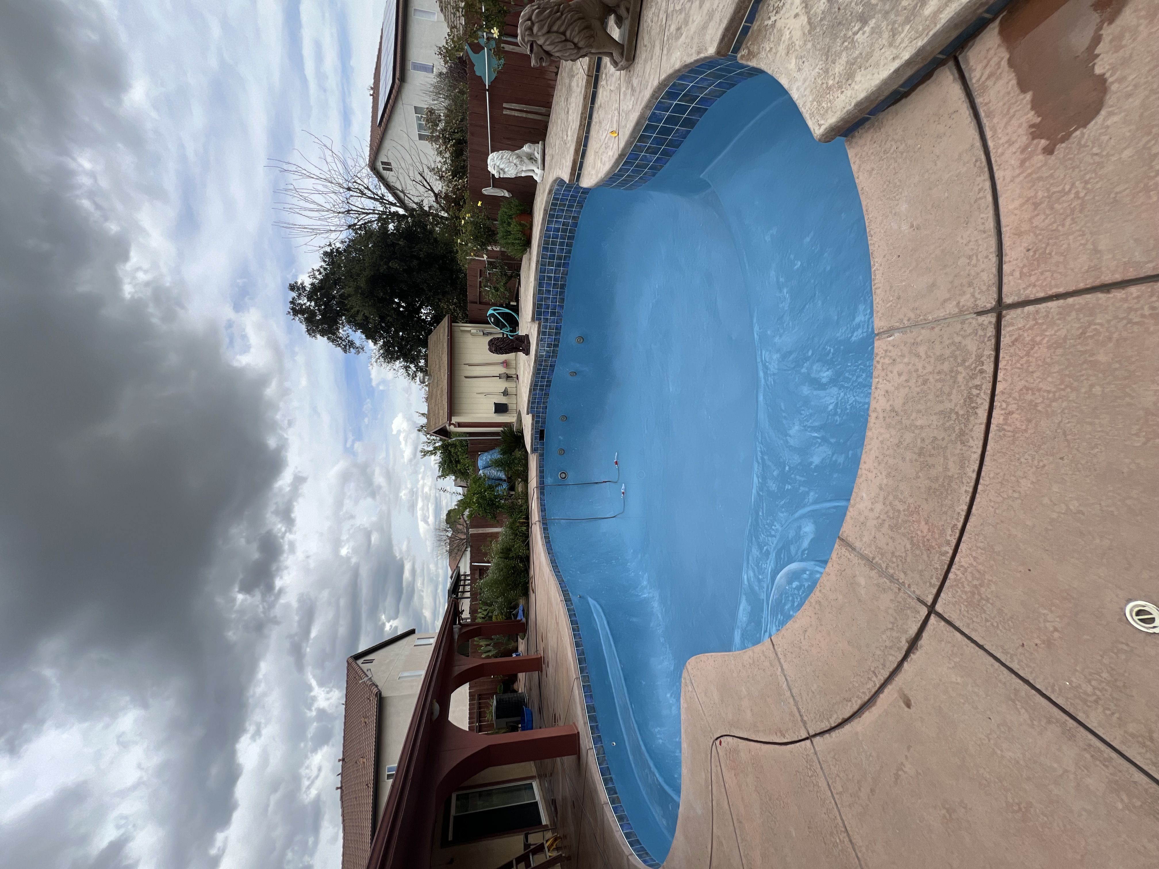 Pool replastered in blue finish, filled and swim-ready